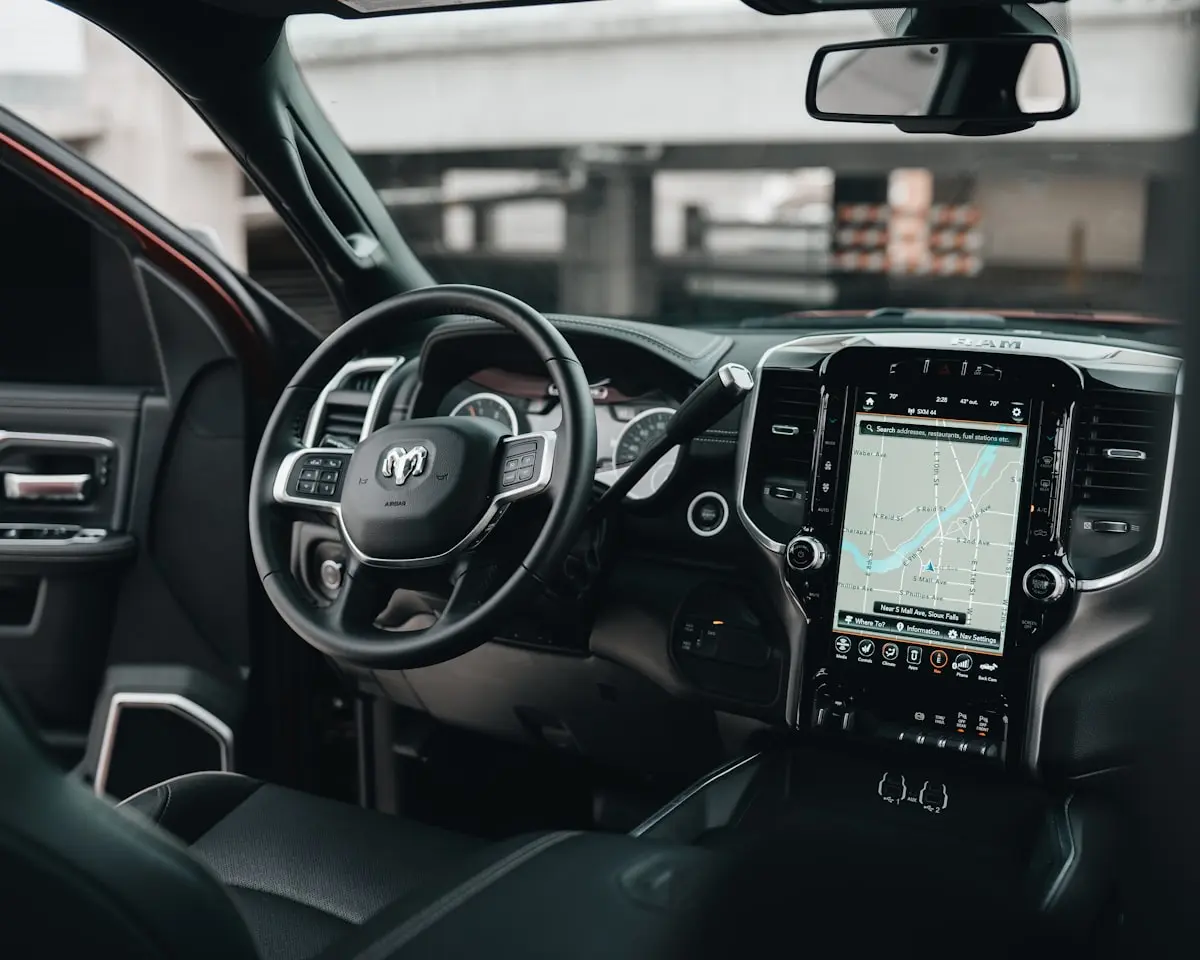 Spotless modern car interior with leather seats and large touchscreen